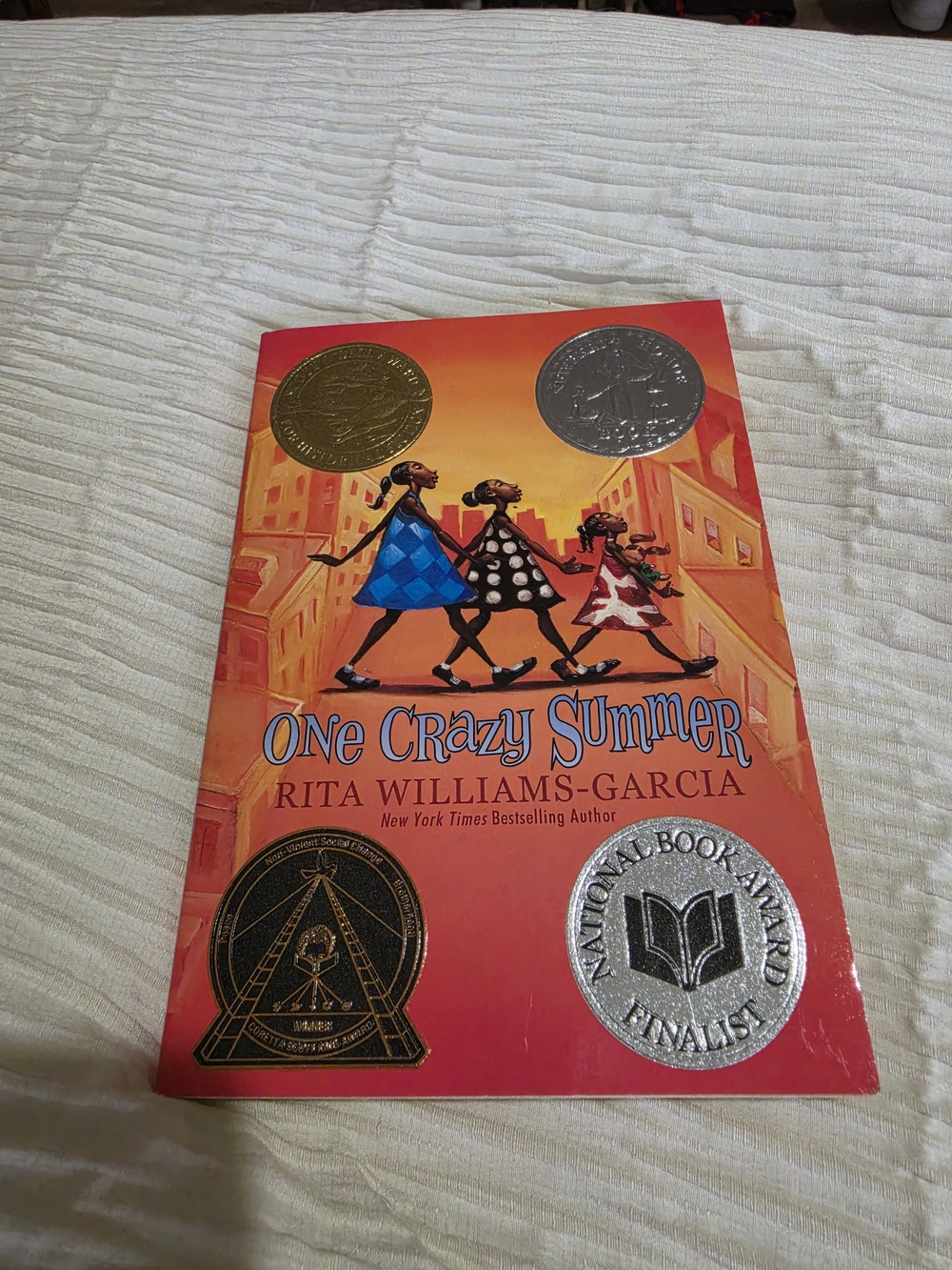 Scholastic One Crazy Summer Paperback - Red, Orange, Blue, Black